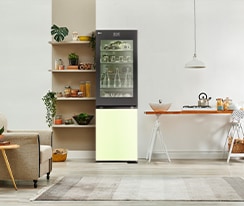 An image of a refrigerator placed in a living room with a cute interior.