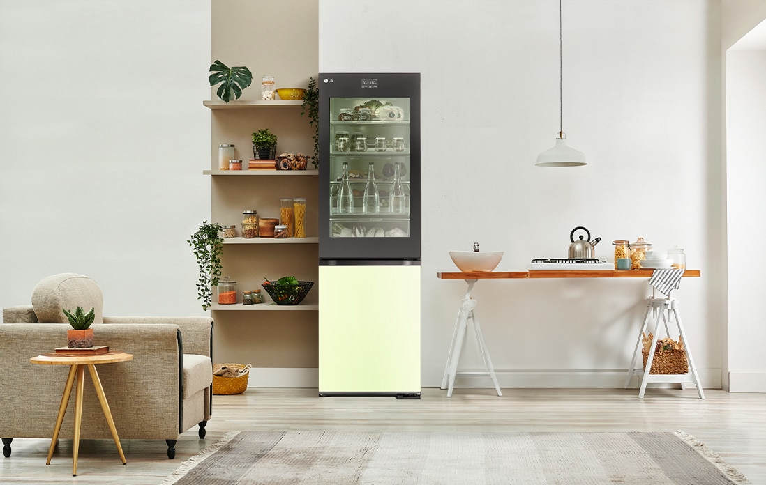 An image of a refrigerator placed in a living room with a cute interior.