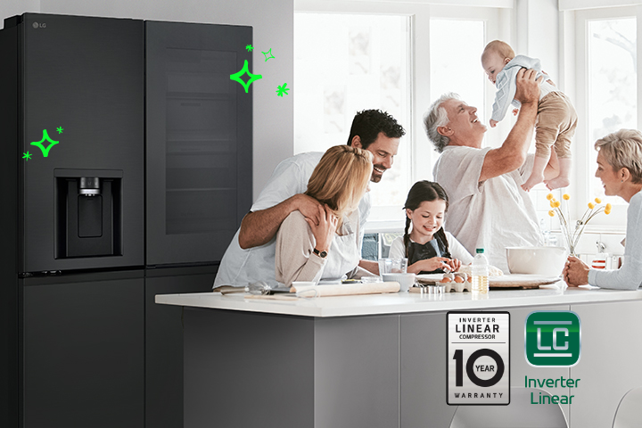 Family members are gathered in front of the refrigerator.