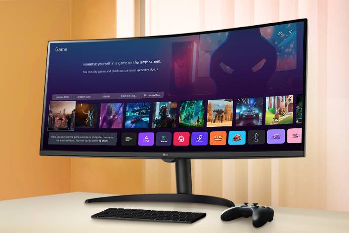 The smart monitor screen placed on the table displays the Game APP screen.