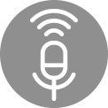 White microphone icon with sound waves emanating upwards on a red background, indicating voice recognition. White microphone icon with sound waves on a grey background, located in the centre, indicating voice control.