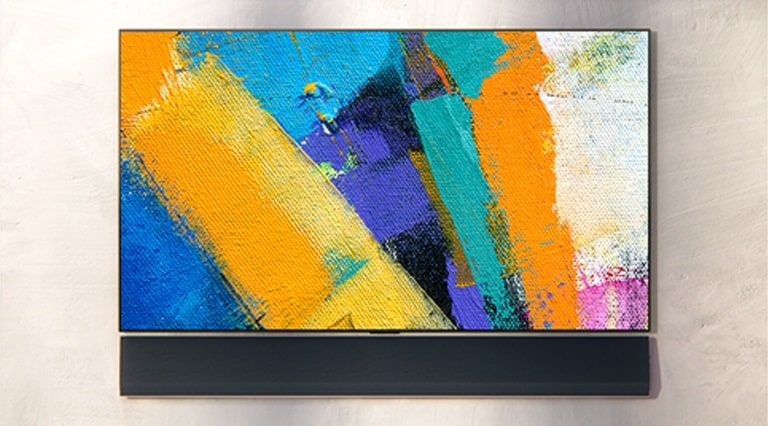 The wall-mounted LG Soundbar and LG TV are shown from three angles. Various colours of paint are shown on the TV screen.