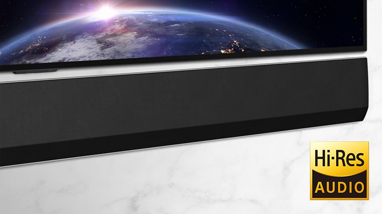 A mid-shot of the the right side of the LG Soundbar. The TV shows an image of space.