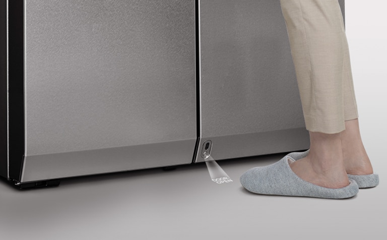 Feet are laid just right in front of auto open door sensor of LG SIGNATURE Refrigerator.