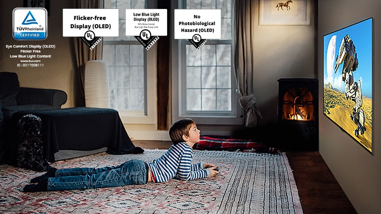 Child sitting on the floor, holding a joystick and playing a game on a TV screen