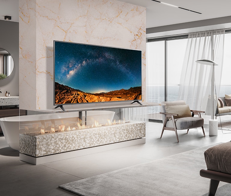 Two displays are installed in the luxurious wine bar. One shows a concert scene, and the other displays two images in one screen showing both a red wine commercial advertisement and a female singer singing.