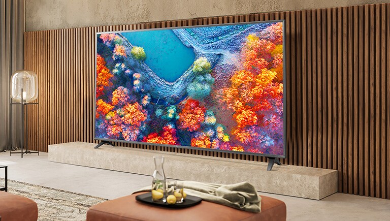 Two displays are installed in the luxurious wine bar. One shows a concert scene, and the other displays two images in one screen showing both a red wine commercial advertisement and a female singer singing.