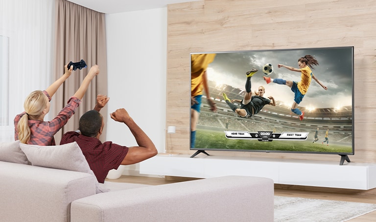 Two displays are installed in the luxurious wine bar. One shows a concert scene, and the other displays two images in one screen showing both a red wine commercial advertisement and a female singer singing.