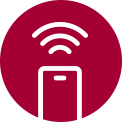 Three icons at the top indicate there are three images in a carousel. The second icon, labelled "Smart Alert", is red. A man sits on the floor looking at his phone with the oven in the background. On the left side of the screen is an image of the ThinQ app on a phone screen with the Wifi icon above it.