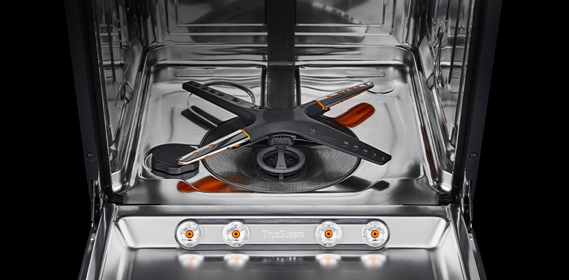 The stainless steel interior of the dishwasher.
