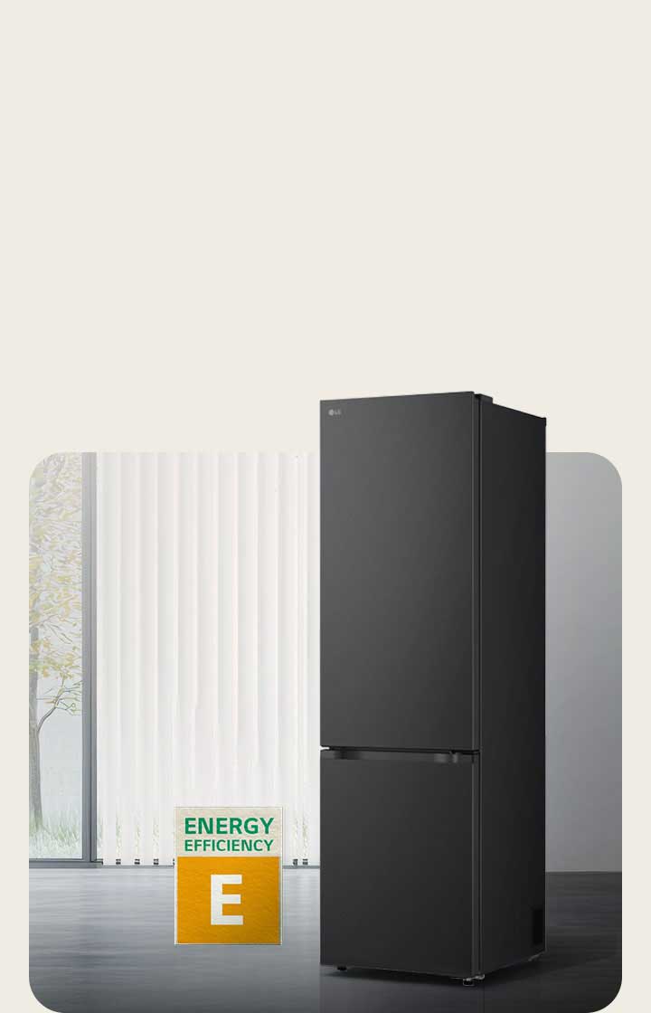 LG bottom freezer (GBBS726CEV) matte black front view in bright room with vertical blinds with 10 year compressor warranty and Energy Efficiency A icons below
