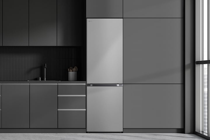 Modern kitchen with a refrigerator that blends seamlessly into surrounding cabinetry, resembling a built-in model.