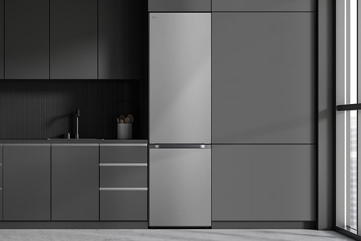 Modern kitchen with a refrigerator that blends seamlessly into surrounding cabinetry, resembling a built-in model.