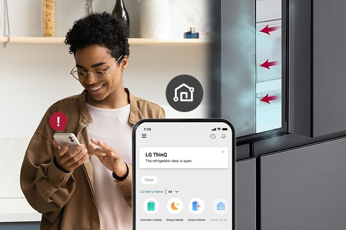 Man receiving open door alert from LG refrigerator via smartphone app.	