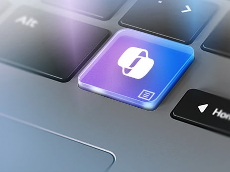 The image displays a close-up of a keyboard, focusing on a colorful key with the Windows Copilot icon.