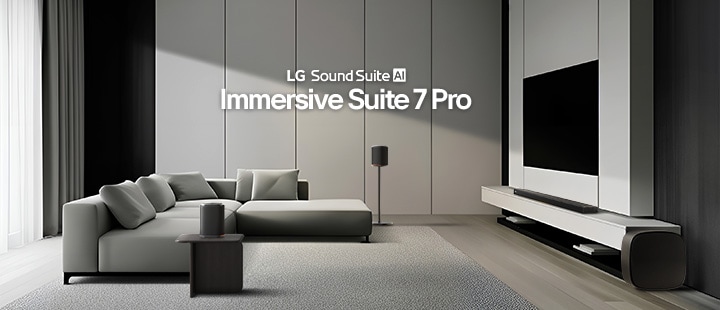 A living room with a TV and Sound Suite set, a soundbar, a pair of speakers beside the sofa and on a side table, and a woofer next to the TV.