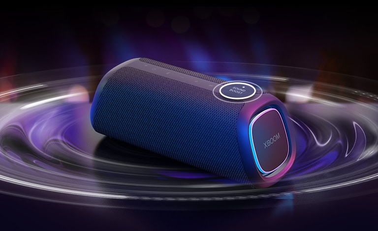 LG XBOOM GO XG7 is placed on the table. The sound Boost button is enlarged and the sound wave effects are under the speaker. Play the video.