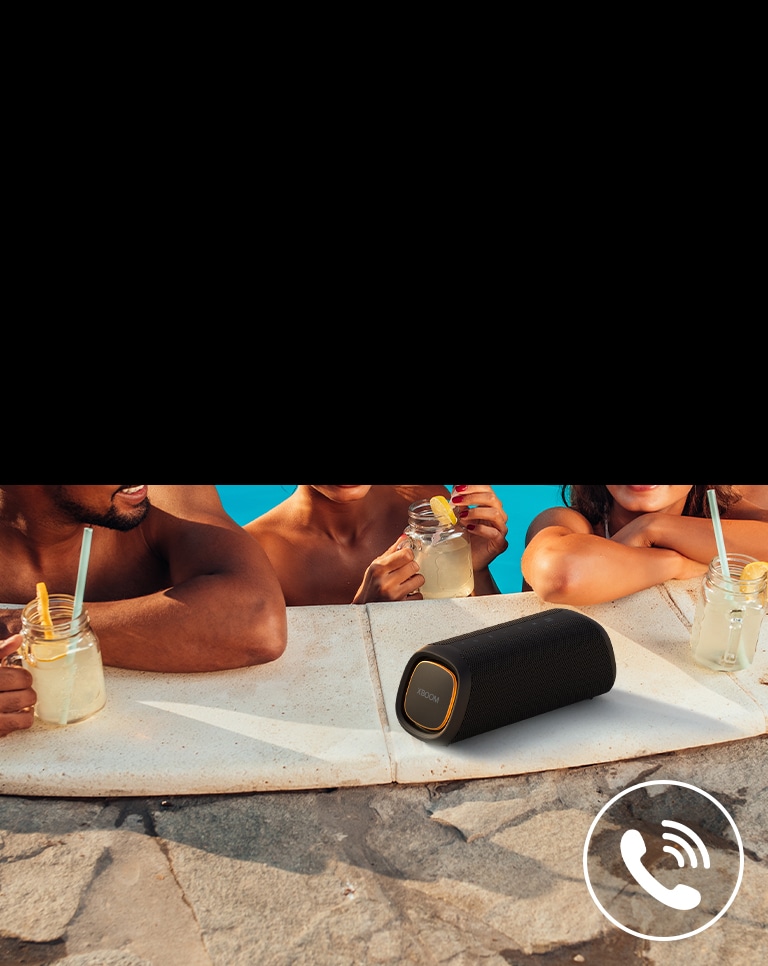 LG XBOOM Go XG7 is placed on the poolside. Three people are talking through the speaker in the pool.