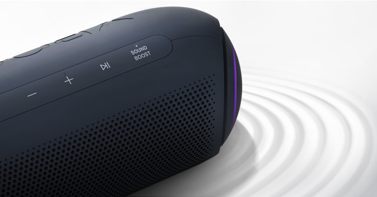 On a white background, LG XBOOM Go faces the upper right with purple lighting, there is a ripple effect under the product.