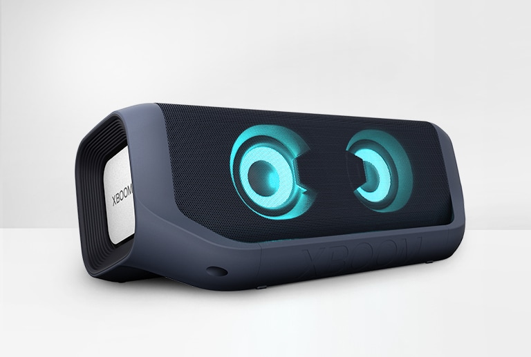 On a white background, there is an angled view of LG XBOOM Go PN7 with sky blue lighting.