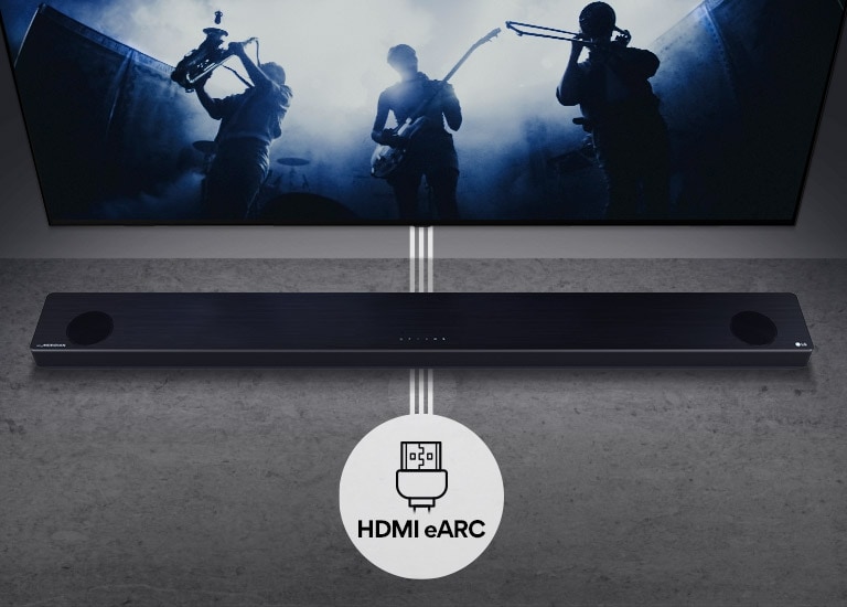 TV is on the wall. TV shows a group of band in black silhouette. LG Soundbar is right below TV on a gray shelf. There is a HDMI eARC icon below the soundbar.