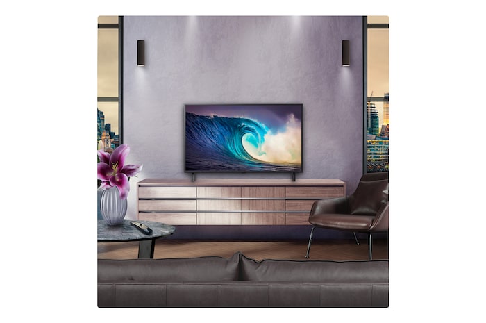 Perspective from the inside of a cave looking out to its entrance where a blue sky and horizon can be seen. The whole scene is split in half to show the capability of QNED's Advanced Local Dimming. On one side, the colors and detail are washed out and the visuals seem muddy. The label says, Conventional LED. The other side has great blacks, better contrast, brightness and color.