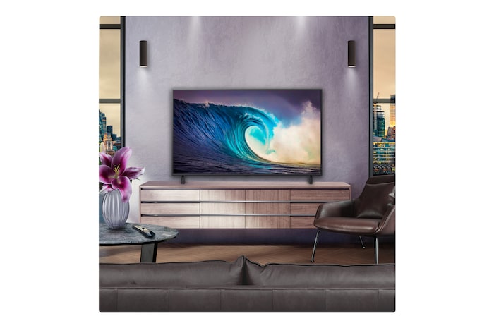 Perspective from the inside of a cave looking out to its entrance where a blue sky and horizon can be seen. The whole scene is split in half to show the capability of QNED's Advanced Local Dimming. On one side, the colors and detail are washed out and the visuals seem muddy. The label says, Conventional LED. The other side has great blacks, better contrast, brightness and color.