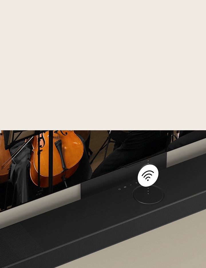 LG OLED TV and soundbar mounted on the wall with a white Wi-Fi symbol graphic in the middle.