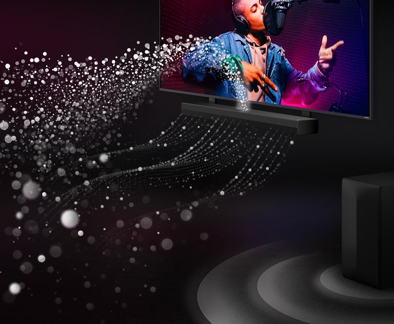 LG Soundbar and LG TV US70TY in a black room playing a musical performance. White droplets representing soundwaves shoot upwards and forward from the soundbar. A subwoofer is creating a sound effect from the bottom.