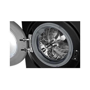 The white LG 10kg/6kg washer-dryer FWY606WWLN1, featuring a distinctive black porthole ring, installed in a stylish, modern laundry closet.