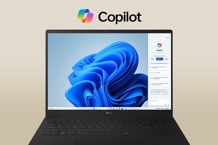 A laptop featuring the Windows Copilot logo above the screen and Windows Copilot interface on the display, showcasing a sleek design with a large screen and the Windows 11 interface in the background.