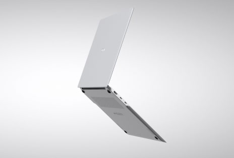 Video shows a laptop partially open from the side with a slim side profile.