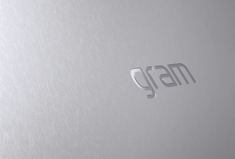 Video shows small stones falling onto the laptop cover surface.