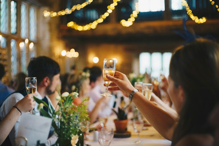 A toast at a sophisticated gathering, capturing a moment of celebration that calls for high-end gifts for gents to mark milestones.