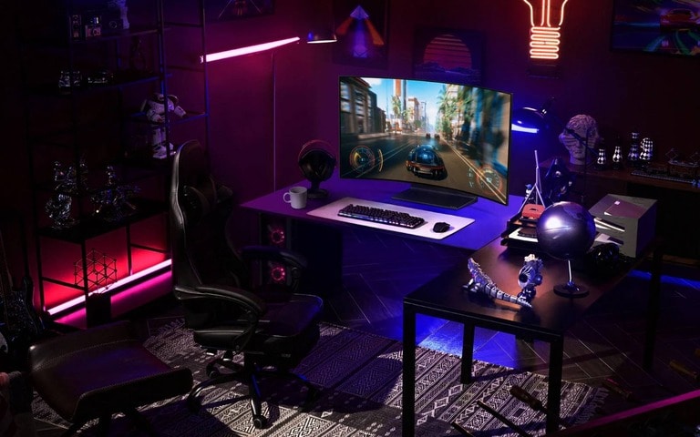 A vibrant gaming room with a curved monitor showing a car racing game, surrounded by neon lights and decorated with tech and sci-fi memorabilia, complete with a high-backed gaming chair and custom PC.