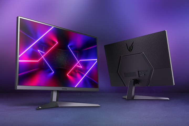 Two LG Monitors, one facing outwards with a dyncamic screenfill in a purple lit room