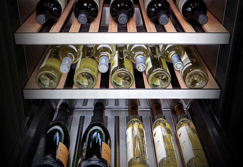 Different types of wine organised on a wine rack