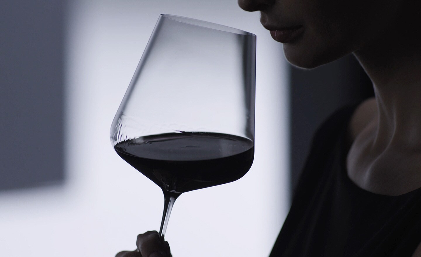 Woman tasting her wine