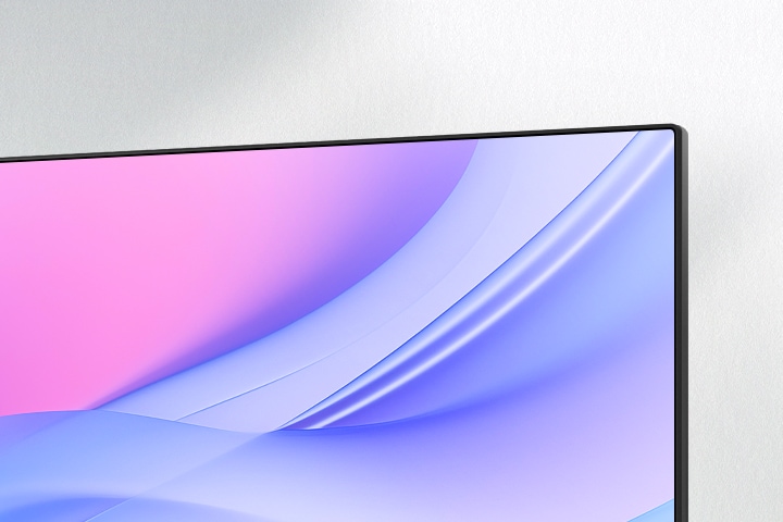 A front view of a modern monitor with a slim, minimalist stand. The monitor, initially angled to the left, smoothly rotates to face forward and locks into place. As it settles, a streak of white light quickly traces along the monitor’s edges, emphasising its sleek bezel design. The display shows a soft gradient of pink and purple tones, while side images highlight the stand’s low-profile base and elegant form.