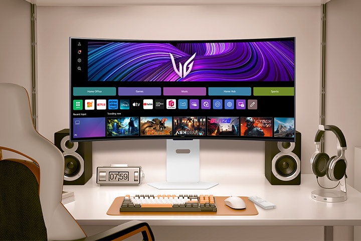 The video shows a front-facing monitor on a desk, alternating between webOS images and gameplay visuals.