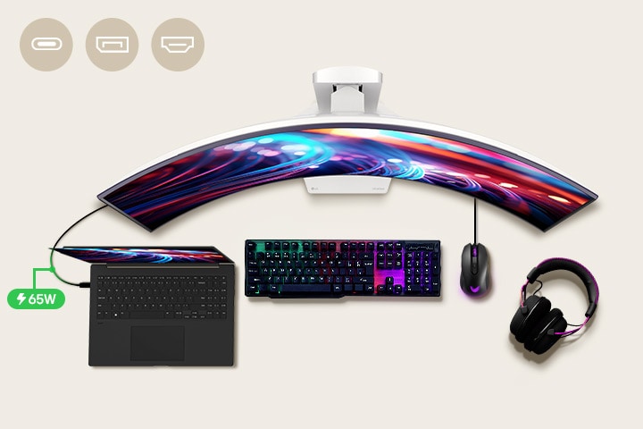 A 39-inch gaming monitor is positioned in the center of the desk, with various IT devices placed around it.	