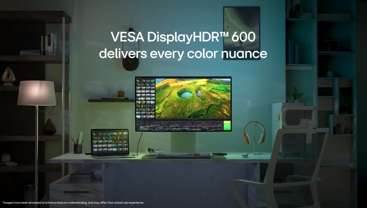 LG UltraFine 6K 32U990A in a cozy environment set up with laptop, headphone, mouse and keyboard with VESA DisplayHDR 600 message