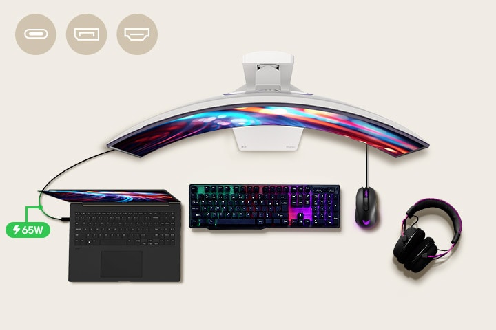 A 45-inch gaming monitor is positioned in the center of the desk, with various IT devices placed around it. 
