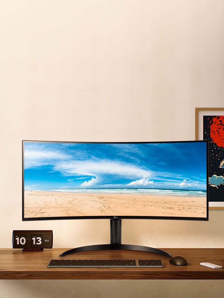 There is a monitor on the desk, and a movie is playing on the monitor screen.