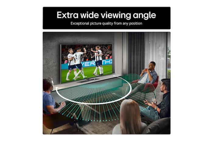 Living room space with a wall-mounted LG OLED TV. On the TV is a mountain range against a dark evening sky filled with stars. This scene is split in half. One side shows a duller, grayer version of the landscape labeled, Non Perfect Black display. On the other side is a more pleasing picture with a larger dynamic range of blacks and whites. 