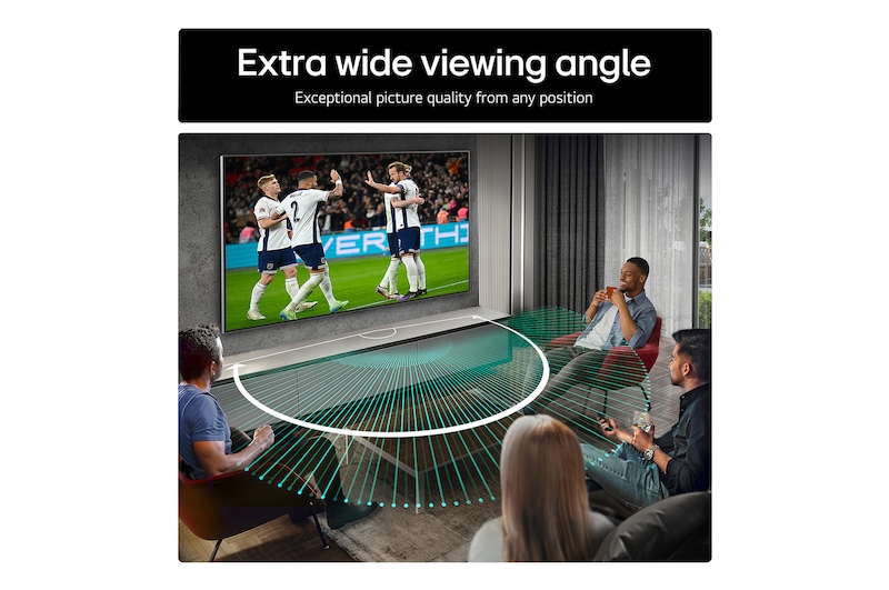Living room space with a wall-mounted LG OLED TV. On the TV is a mountain range against a dark evening sky filled with stars. This scene is split in half. One side shows a duller, grayer version of the landscape labeled, Non Perfect Black display. On the other side is a more pleasing picture with a larger dynamic range of blacks and whites. 