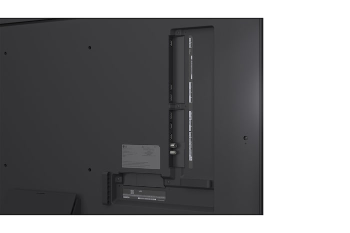 LG AI Magic Remote in the foreground. The AI button icon is highlighted. In the background is the LG webOS UI. The mouse cursor implies that the remote is in use. Text explains how the remote's functions and controls make navigating webOS easy. 