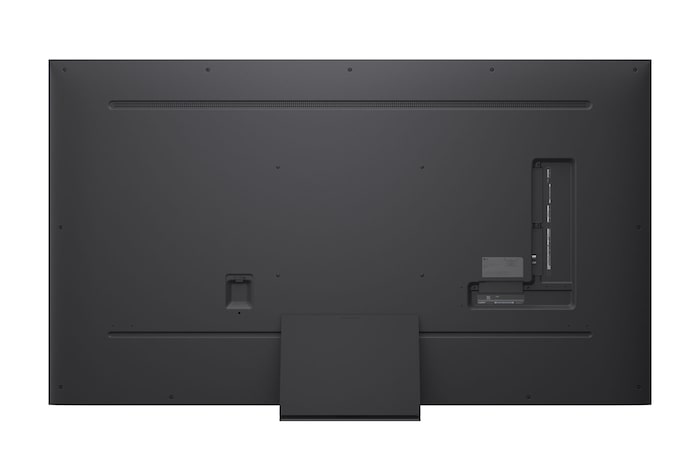 A girl and a dog are seated in front of a LG QNED TV mounted on a wall depicting three elephants walking outwards above a LG Soundbar. The title talks about how every action is more thrilling on a massive screen.