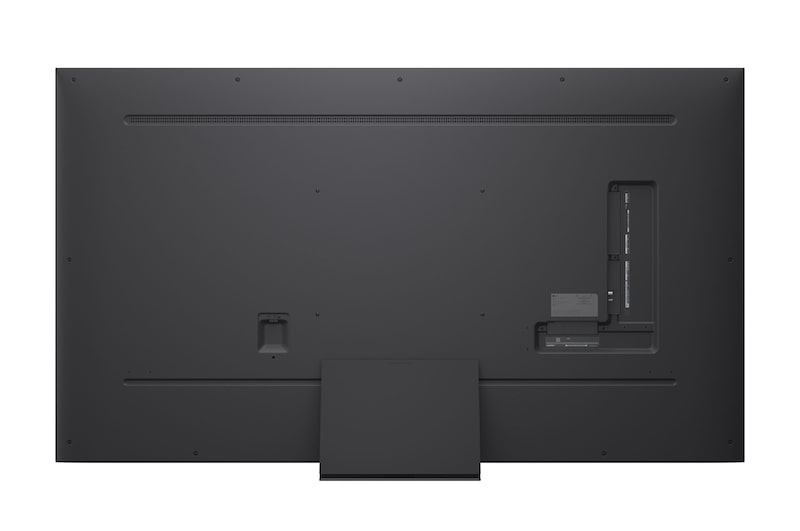 A girl and a dog are seated in front of a LG QNED TV mounted on a wall depicting three elephants walking outwards above a LG Soundbar. The title talks about how every action is more thrilling on a massive screen.