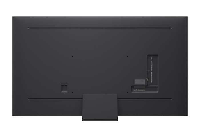 A girl and a dog are seated in front of a LG QNED TV mounted on a wall depicting three elephants walking outwards above a LG Soundbar. The title talks about how every action is more thrilling on a massive screen.